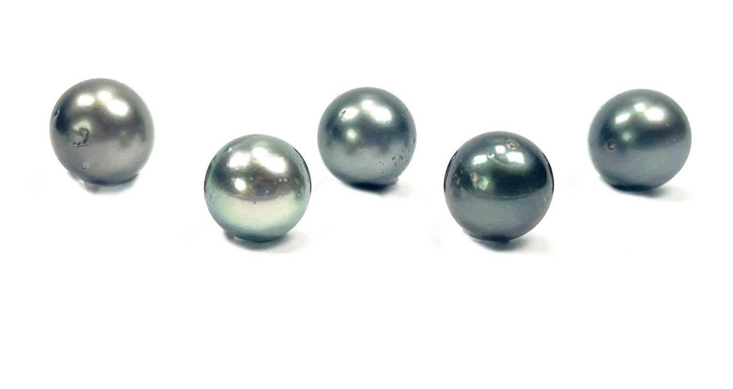 Lot 43 - Five Back Cultured Pearls.