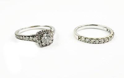 Lot 219 - A Diamond Cluster Ring and a Wedding Ring.