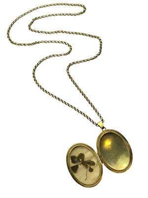 Lot 307 - A large oval locket and open link chain.