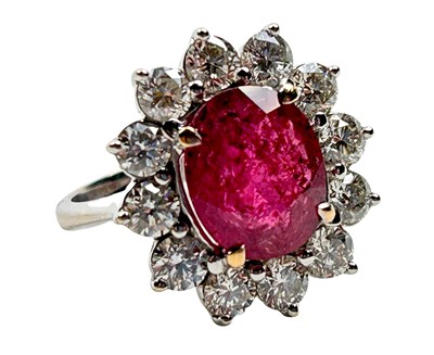 Lot 228 - Diamond and Ruby Cluster Ring.