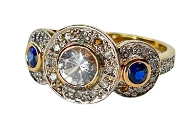 Lot 306 - Diamond and Sapphire Ring.