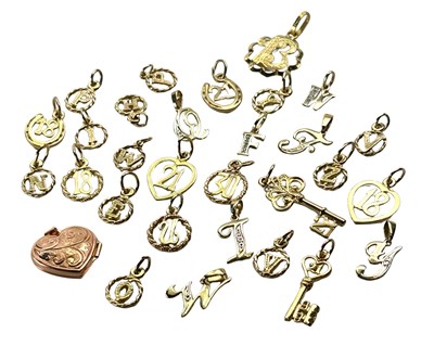 Lot 235 - A Collection of Yellow Gold Charms.