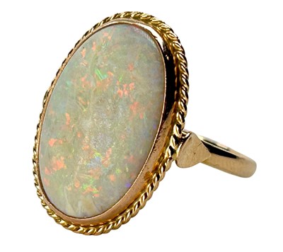 Lot 318 - Yellow Gold Opal Ring.