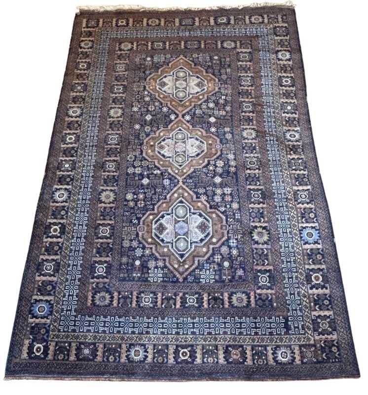 Lot 135 - Large Earth-Toned Wool Rug.
