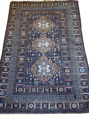 Lot 135 - Large Earth-Toned Wool Rug.