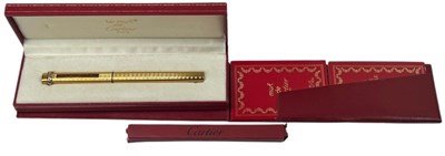 Lot 150 - Les Must De Cartier Gold tone Ball Point Pen.
