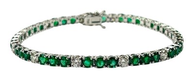 Lot 306 - An Emerald & Diamond Tennis Bracelet.