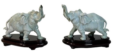 Lot 166 - A Pair of Carved Jade Mottled Green Coloured Elephants.