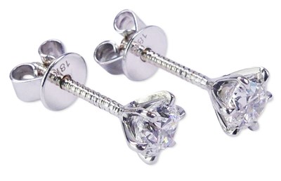 Lot 228 - A Pair of Round Brilliant Cut Diamond Studs.