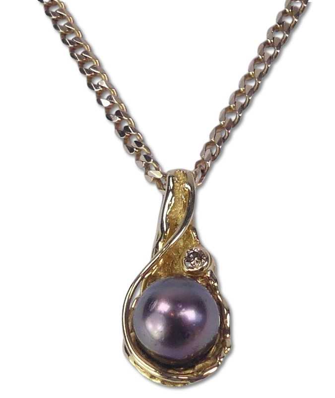 Lot 224 - Pearl and Diamond Pendant.