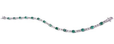 Lot 282 - Emerald and Diamond Tennis Bracelet.