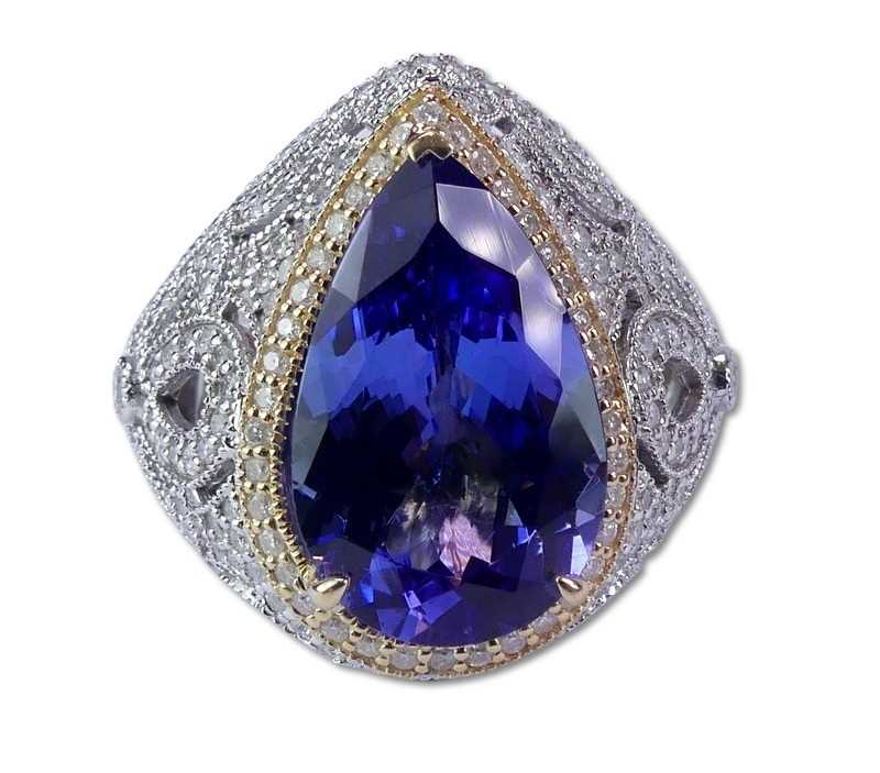 Lot 232 - Tanzanite and Diamond Halo Ring.