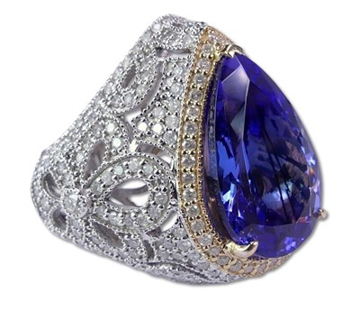 Lot 232 - Tanzanite and Diamond Halo Ring.