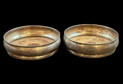 Lot 26 - Two Silver matching Wine Bottle Coasters.