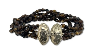Lot 412 - A Five Strand Smokey Quartz Bracelet.