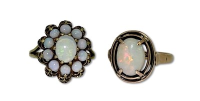 Lot 344 - A Couple of Opal Rings.