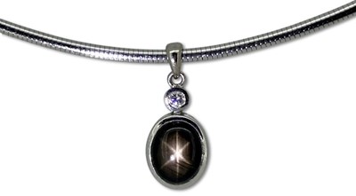 Lot 378 - White Gold Star Sapphire Omega Choker.