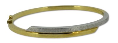 Lot 247 - An 18ct Yellow Gold Oval Shaped Bangle.