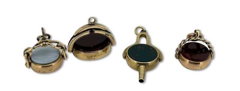 Lot 268 - Four Spinner Fob Charms.