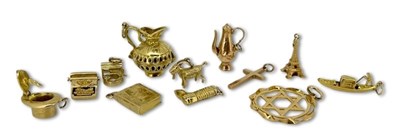 Lot 280 - A Collection of Yellow Gold Charms.