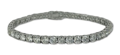 Lot 351 - A Classic Diamond Tennis Bracelet.