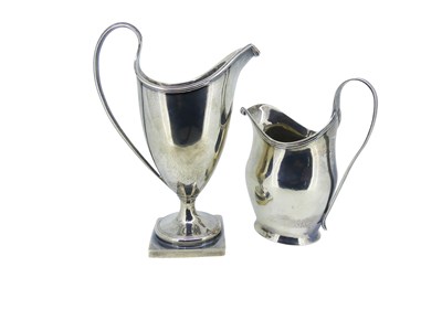 Lot 546 - Two Sterling Silver Milk Jugs.