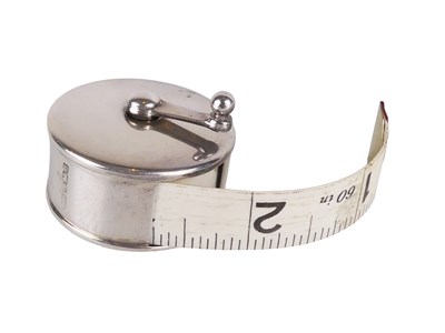 Lot 569 - Sterling Silver Measuring Tape.