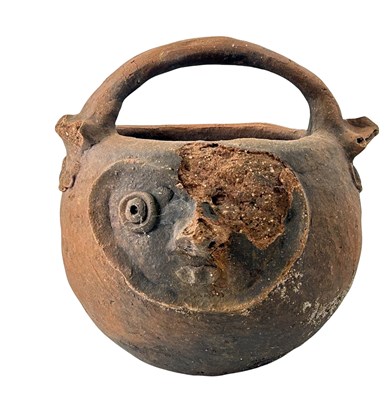 Lot 132 - A Carved Papua New Guinea Raku Fire Pot.