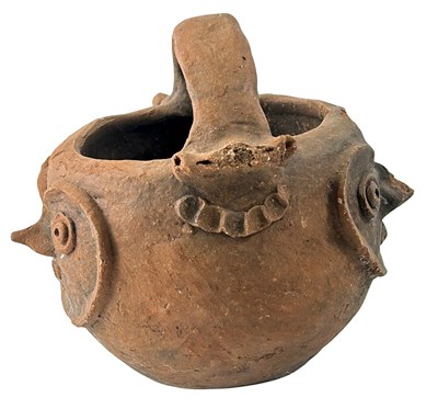 Lot 132 - A Carved Papua New Guinea Raku Fire Pot.