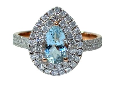 Lot 256 - Aquamarine & Diamond Double Halo Ring.